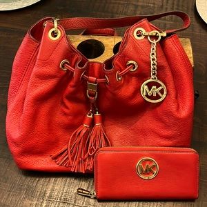 Michael Kors bay and wallet.